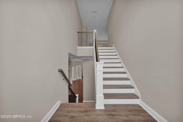 452 Deer Valley Dr, Ponte Vedra, FL 32081 - staircase featuring a towering ceiling and wood finished floors