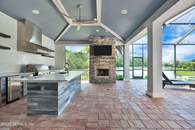 452 Deer Valley Dr, Ponte Vedra, FL 32081 - view of patio with area for grilling, an outdoor stone fireplace, and glass enclosure