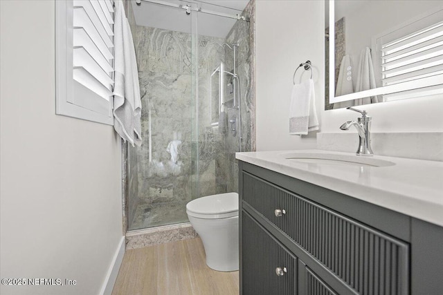 2638 W End St, Jacksonville, FL 32233 - bathroom with vanity, a marble finish shower, and wood finished floors