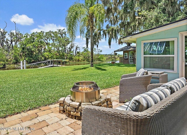 2638 W End St, Jacksonville, FL 32233 - view of grassy yard with a fire pit and a patio area