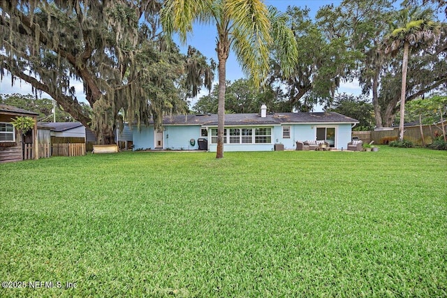 2638 W End St, Jacksonville, FL 32233 - rear view of property featuring a fenced backyard and an outdoor hangout area