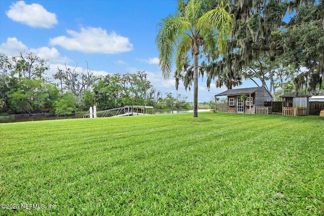 2638 W End St, Jacksonville, FL 32233 - view of green lawn with a water view and an outdoor structure