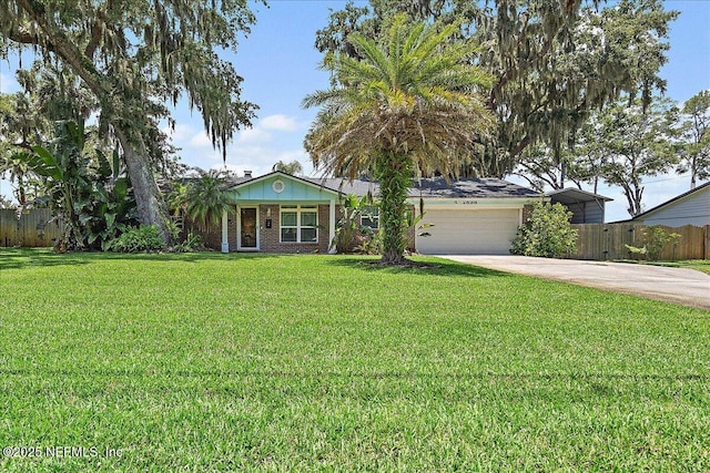 2638 W End St, Jacksonville, FL 32233 - ranch-style home featuring concrete driveway, an attached garage, and brick siding