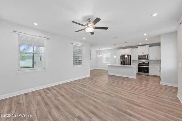 117 Redbud Ln, Yulee, FL 32097 - unfurnished living room featuring ceiling fan, light wood-style flooring, and recessed lighting