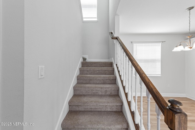 117 Redbud Ln, Yulee, FL 32097 - staircase with a chandelier and wood finished floors