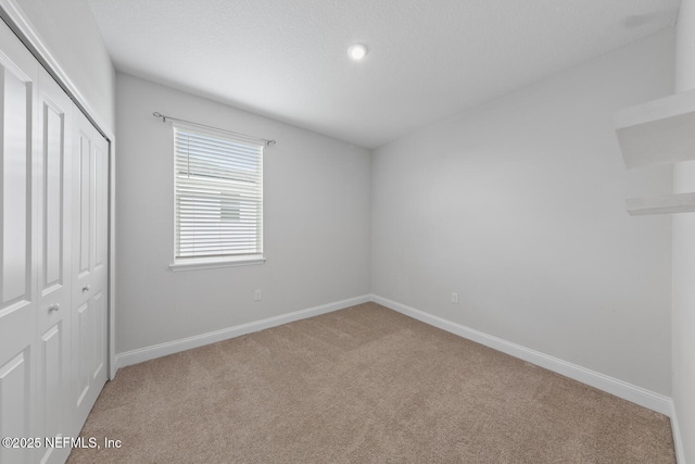 117 Redbud Ln, Yulee, FL 32097 - unfurnished bedroom featuring carpet, a closet, and recessed lighting