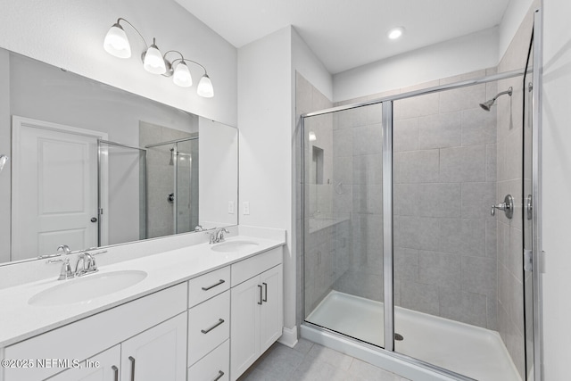 117 Redbud Ln, Yulee, FL 32097 - bathroom featuring a shower stall, double vanity, and tile patterned flooring