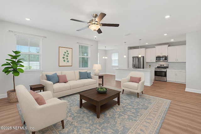 117 Redbud Ln, Yulee, FL 32097 - living area with light wood-style flooring, ceiling fan, and recessed lighting