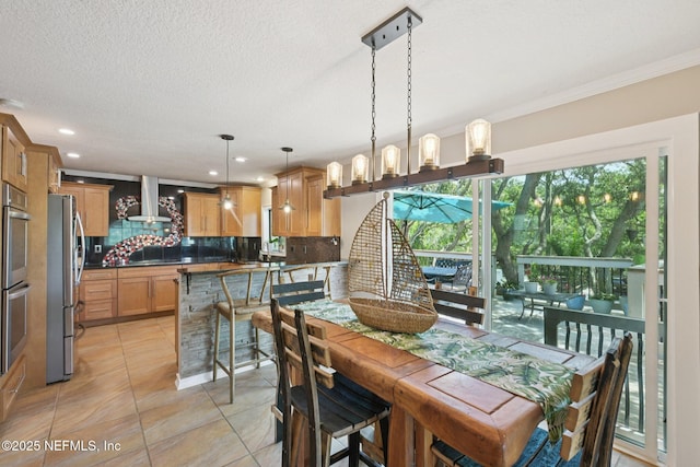 136 Sherwood Ave, Saint Augustine, FL 32084 - dining area with light tile patterned floors, recessed lighting, ornamental molding, and a textured ceiling