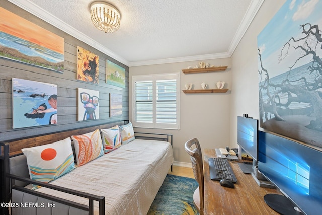 136 Sherwood Ave, Saint Augustine, FL 32084 - bedroom featuring a textured ceiling, crown molding, wood finished floors, a desk, and wooden walls