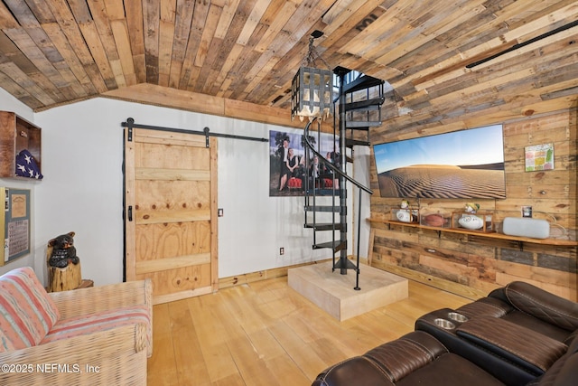 136 Sherwood Ave, Saint Augustine, FL 32084 - living area with wooden walls, lofted ceiling, hardwood / wood-style flooring, a barn door, and wooden ceiling