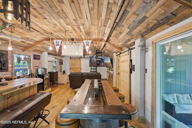 136 Sherwood Ave, Saint Augustine, FL 32084 - dining room with a barn door, wood ceiling, and wood finished floors
