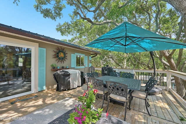 136 Sherwood Ave, Saint Augustine, FL 32084 - wooden deck with outdoor dining space and a grill