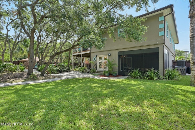 136 Sherwood Ave, Saint Augustine, FL 32084 - rear view of property featuring french doors and a yard