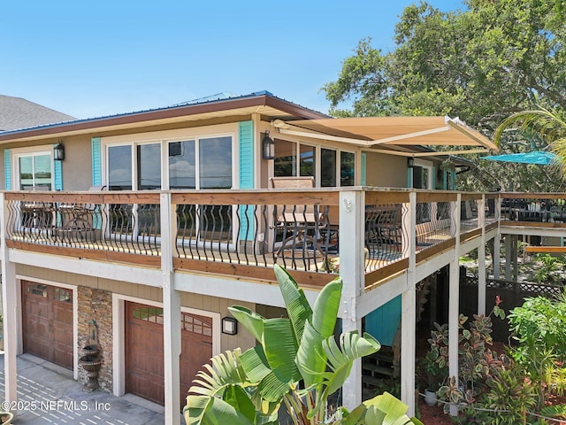 136 Sherwood Ave, Saint Augustine, FL 32084 - rear view of house with a garage