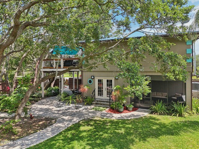 136 Sherwood Ave, Saint Augustine, FL 32084 - back of house with french doors, a yard, and a deck