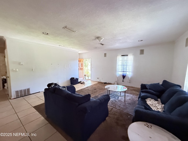 427 Crestwood St, Jacksonville, FL 32208 - tiled living room featuring a textured ceiling