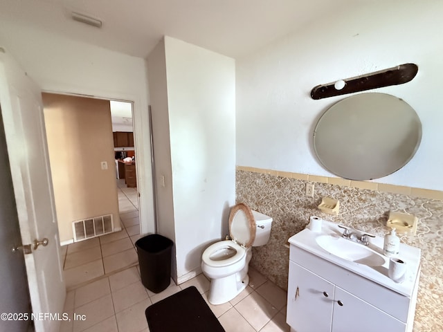 427 Crestwood St, Jacksonville, FL 32208 - half bath with vanity, tile patterned floors, wainscoting, and tile walls