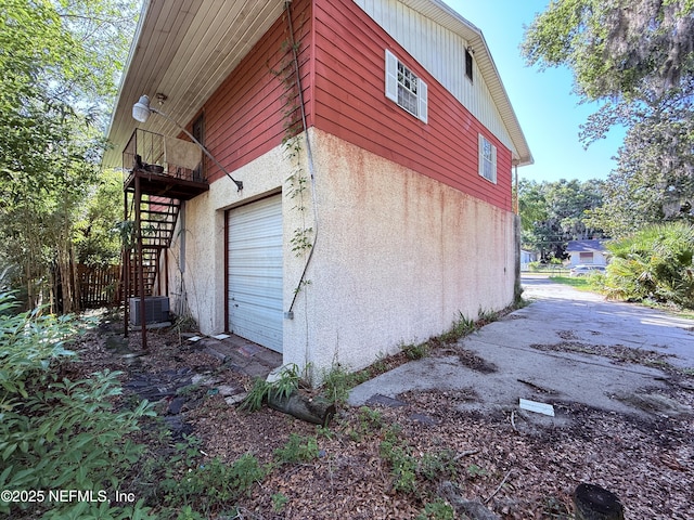 427 Crestwood St, Jacksonville, FL 32208 - view of side of property featuring stairway and a central air condition unit