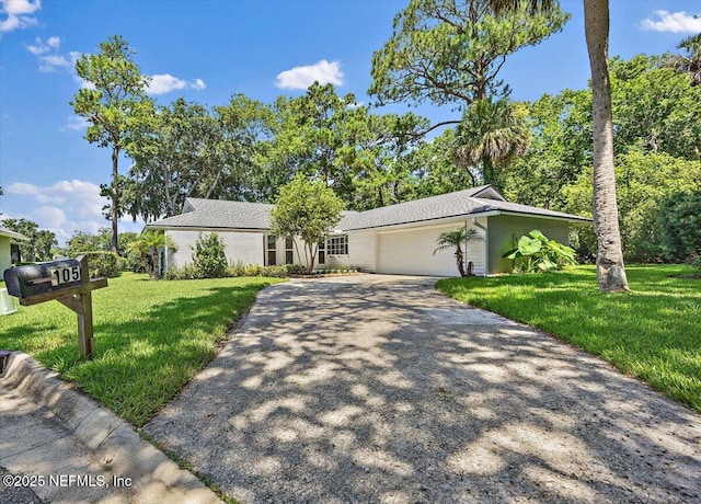 105 Lucina Ln, Ponte Vedra Beach, FL 32082 - mid-century inspired home featuring an attached garage, a front lawn, and concrete driveway