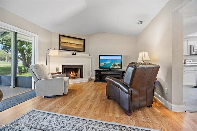 105 Lucina Ln, Ponte Vedra Beach, FL 32082 - living room with light wood-type flooring and a lit fireplace