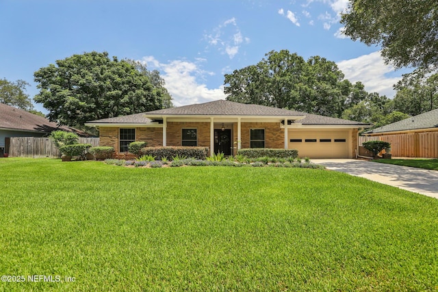 12137 Dividing Oaks Trl E, Jacksonville, FL 32223 - single story home with a garage, concrete driveway, brick siding, and roof with shingles