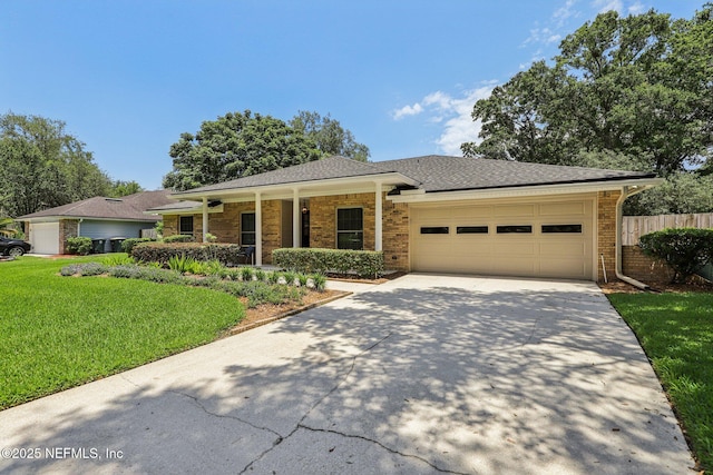 12137 Dividing Oaks Trl E, Jacksonville, FL 32223 - single story home featuring a garage, concrete driveway, brick siding, and roof with shingles