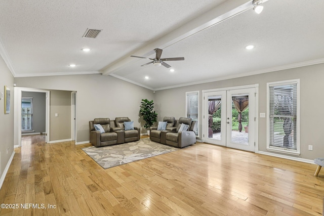 12137 Dividing Oaks Trl E, Jacksonville, FL 32223 - living area with light wood-style flooring, crown molding, a ceiling fan, a textured ceiling, and french doors