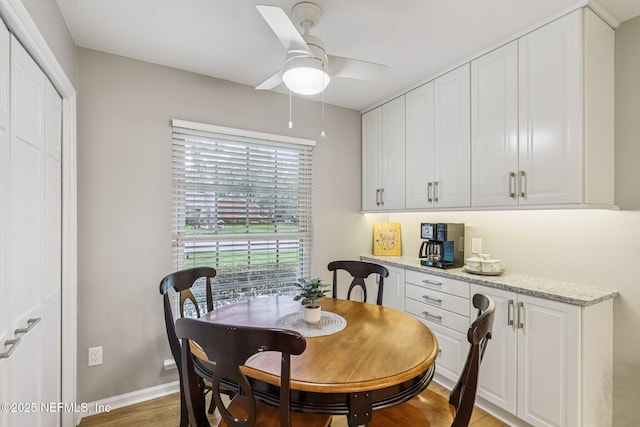 12137 Dividing Oaks Trl E, Jacksonville, FL 32223 - dining room with ceiling fan and light wood finished floors