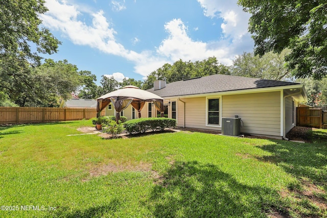 12137 Dividing Oaks Trl E, Jacksonville, FL 32223 - rear view of house with a fenced backyard, a gazebo, and a chimney