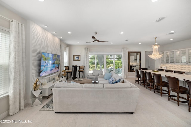 651 Rum Runner Way, Saint Johns, FL 32259 - living room featuring recessed lighting, light wood-style floors, a ceiling fan, and a chandelier