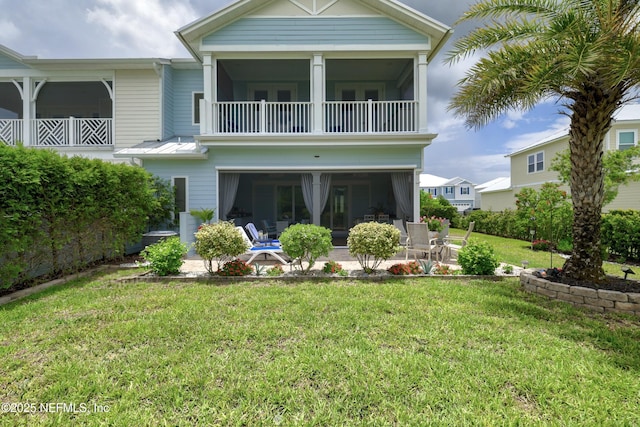651 Rum Runner Way, Saint Johns, FL 32259 - back of property featuring a balcony, a patio area, a yard, and a sunroom