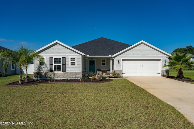 665 Flach Dr, Saint Johns, FL 32259 - ranch-style home featuring a garage, a front yard, driveway, and stone siding