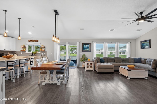 665 Flach Dr, Saint Johns, FL 32259 - living room with dark wood finished floors, plenty of natural light, ceiling fan, and lofted ceiling