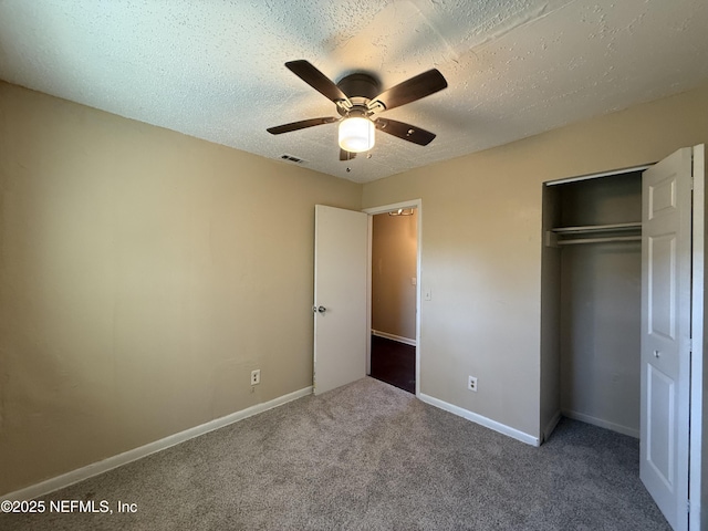1406 W 18th St, Jacksonville, FL 32209 - unfurnished bedroom featuring carpet floors, a closet, a textured ceiling, and ceiling fan