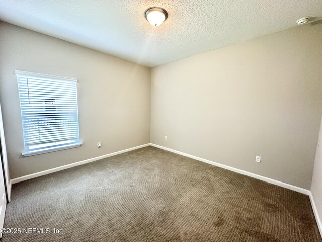 356 Bermudez Way, Saint Augustine, FL 32095 - carpeted spare room with a smoke detector and a textured ceiling
