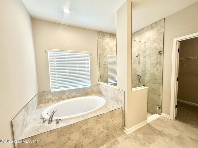 356 Bermudez Way, Saint Augustine, FL 32095 - full bathroom featuring a bath, a stall shower, and a walk in closet
