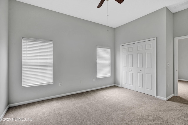 7920 Merrill Rd Unit 403, Jacksonville, FL 32277 - unfurnished bedroom featuring carpet, a closet, and a ceiling fan