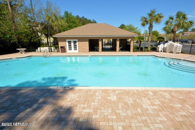 7920 Merrill Rd Unit 403, Jacksonville, FL 32277 - community pool with a patio and french doors