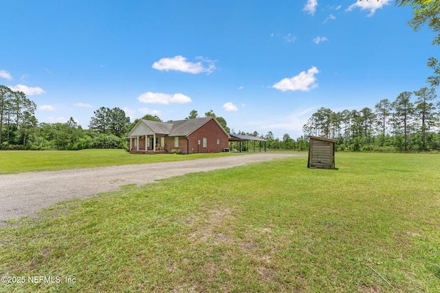 34100 Old Baldwin Rd, Callahan, FL 32011 - view of front of home with dirt driveway and a front lawn