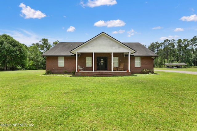 34100 Old Baldwin Rd, Callahan, FL 32011 - ranch-style home featuring a porch, a front lawn, and brick siding