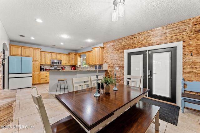 34100 Old Baldwin Rd, Callahan, FL 32011 - dining area featuring light tile patterned floors, a textured ceiling, and recessed lighting
