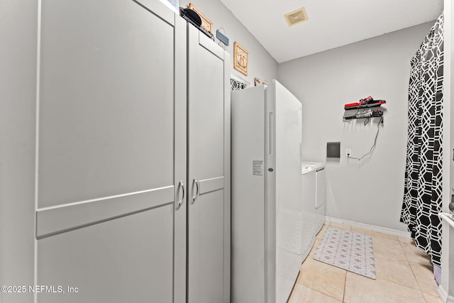 34100 Old Baldwin Rd, Callahan, FL 32011 - bathroom with washing machine and dryer, tile patterned flooring, and a shower with shower curtain