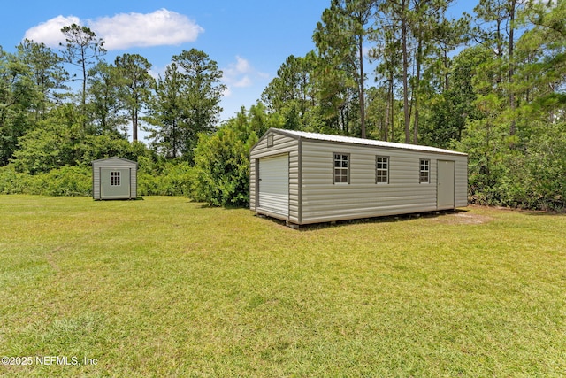 34100 Old Baldwin Rd, Callahan, FL 32011 - view of green lawn with a storage unit and view of scattered trees