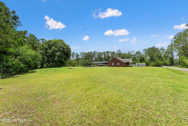 34100 Old Baldwin Rd, Callahan, FL 32011 - view of grassy yard featuring a detached carport