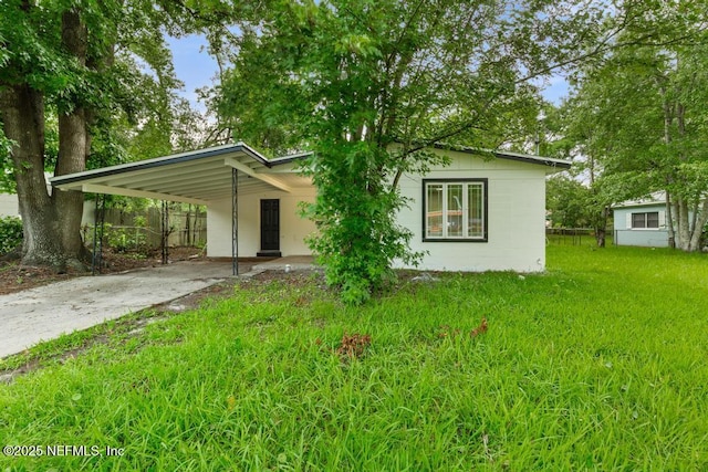9340 Norfolk Blvd, Jacksonville, FL 32208 - view of front of house featuring a carport and driveway