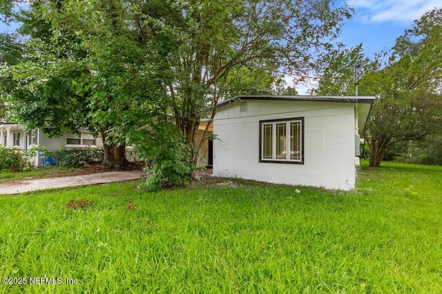 9340 Norfolk Blvd, Jacksonville, FL 32208 - view of front of property with a front yard and concrete block siding