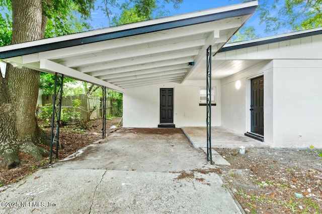 9340 Norfolk Blvd, Jacksonville, FL 32208 - view of parking featuring an attached carport