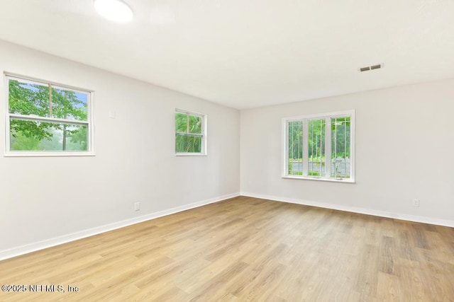 9340 Norfolk Blvd, Jacksonville, FL 32208 - spare room featuring plenty of natural light and light wood-style flooring