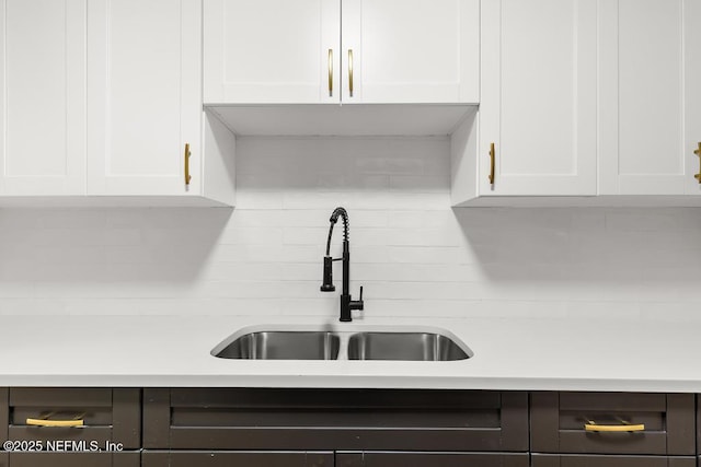 9340 Norfolk Blvd, Jacksonville, FL 32208 - kitchen with tasteful backsplash, white cabinetry, and light countertops
